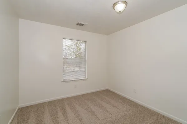 an empty room with a window