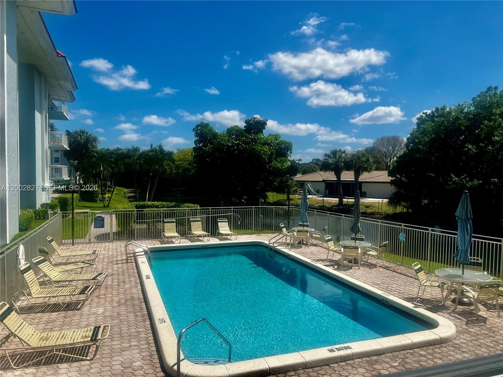 405 South Pine Island Road, Unit 403D Plantation, FL 33324 - Photo 13 of 14 a view of a swimming pool with a patio