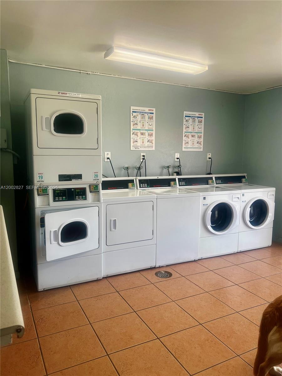 405 South Pine Island Road, Unit 403D Plantation, FL 33324 - Photo 14 of 14 a kitchen with a stove a sink and a microwave