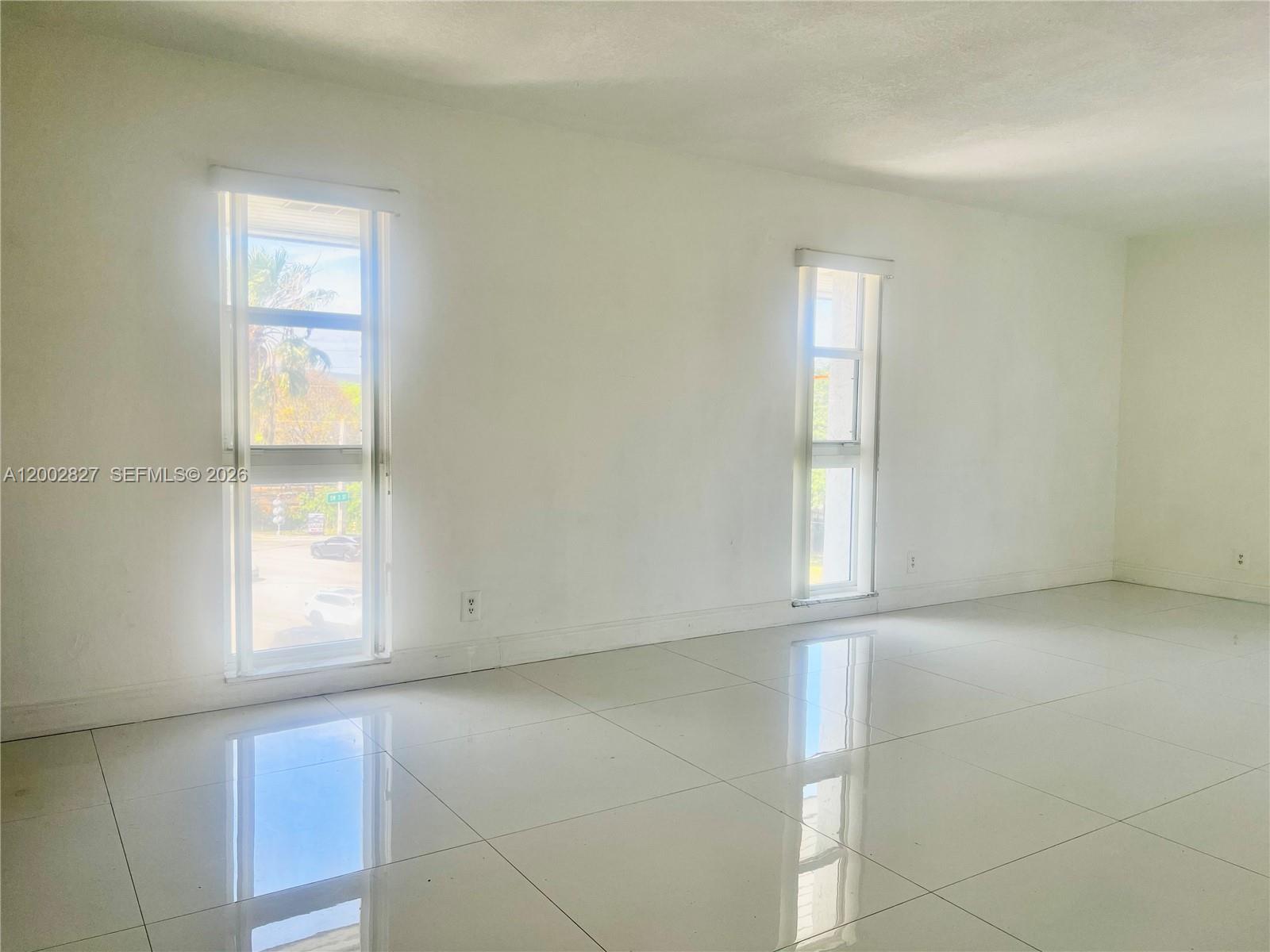 405 South Pine Island Road, Unit 403D Plantation, FL 33324 - Photo 2 of 14 an empty room with windows