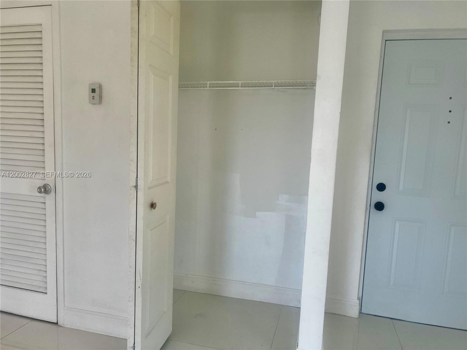 405 South Pine Island Road, Unit 403D Plantation, FL 33324 - Photo 5 of 14 a bathroom with a glass shower door
