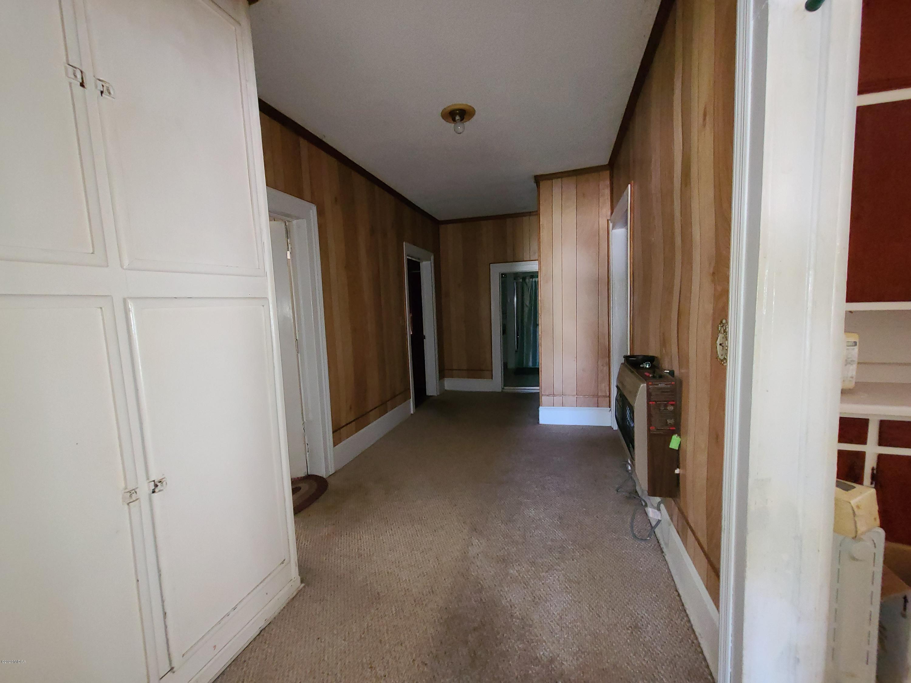 3824 Hartley Bridge Road Macon, GA 31216 - Photo 11 of 26 a view of a hallway with closet and a bathroom
