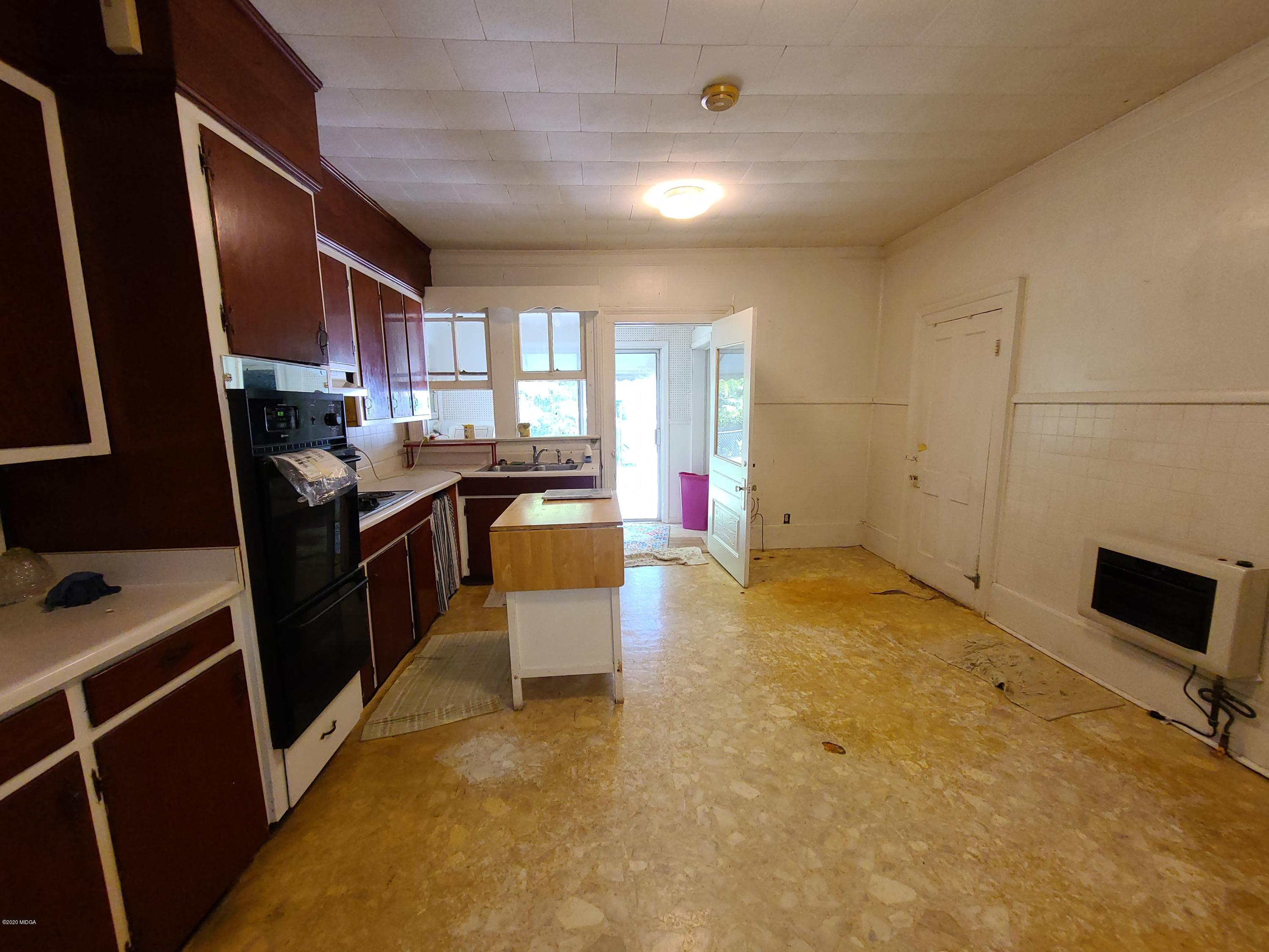 3824 Hartley Bridge Road Macon, GA 31216 - Photo 12 of 26 a kitchen that has a sink and a stove