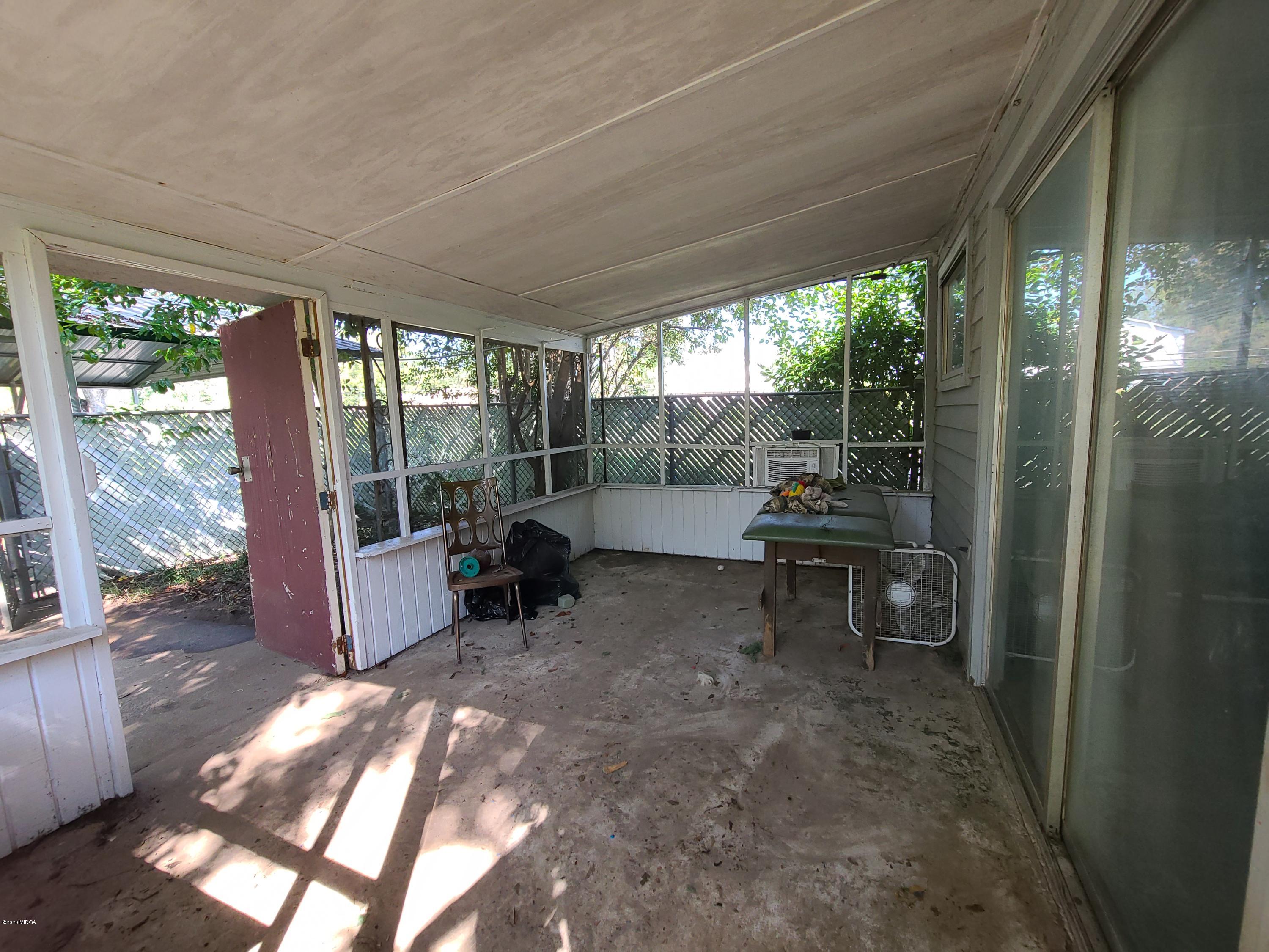 3824 Hartley Bridge Road Macon, GA 31216 - Photo 20 of 26 a view of a room with wooden floor and outdoor seating