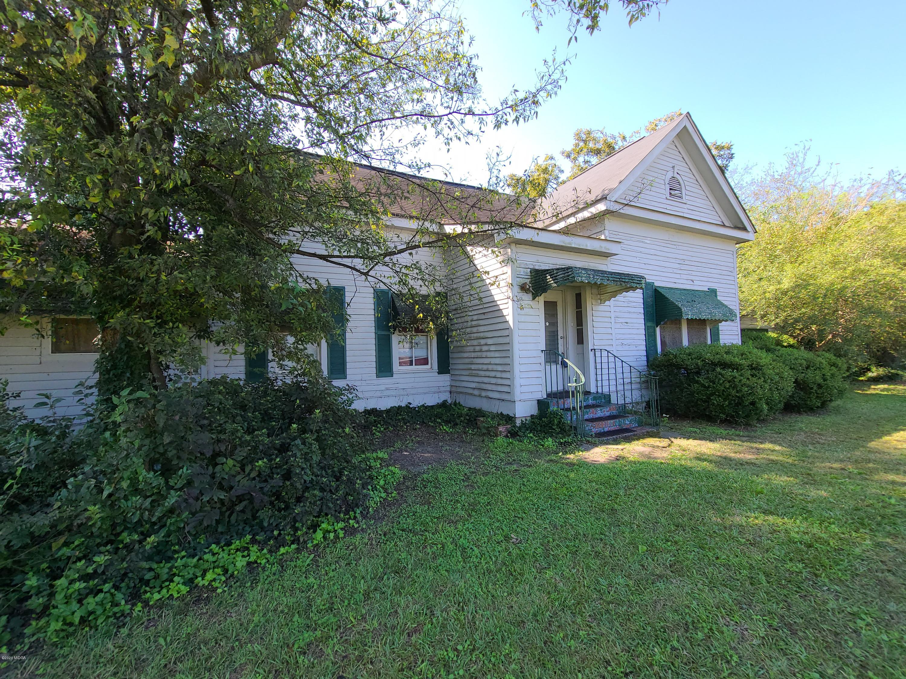 3824 Hartley Bridge Road Macon, GA 31216 - Photo 3 of 26 a front view of a house with a yard