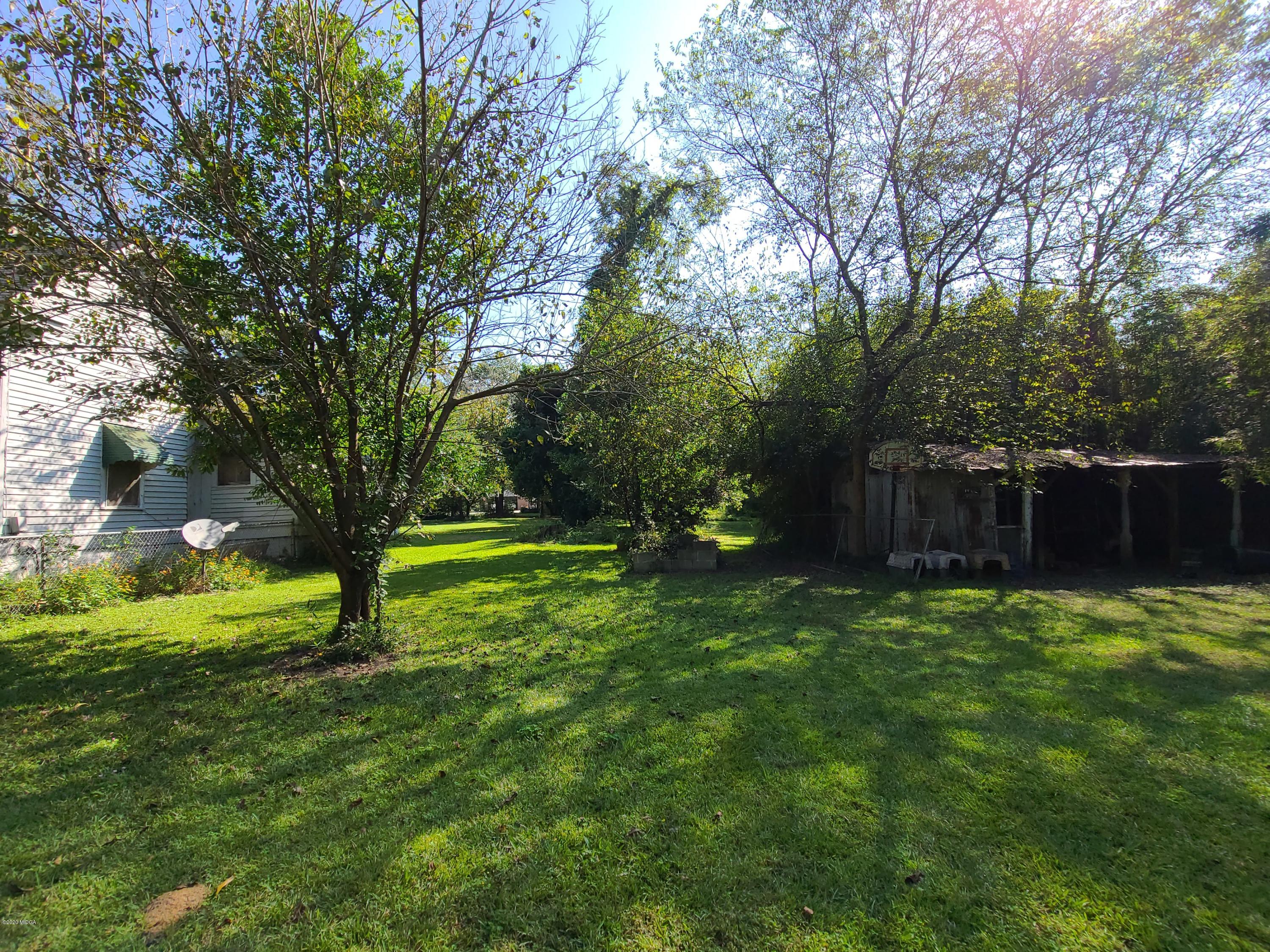 3824 Hartley Bridge Road Macon, GA 31216 - Photo 21 of 26 a view of a backyard with large trees