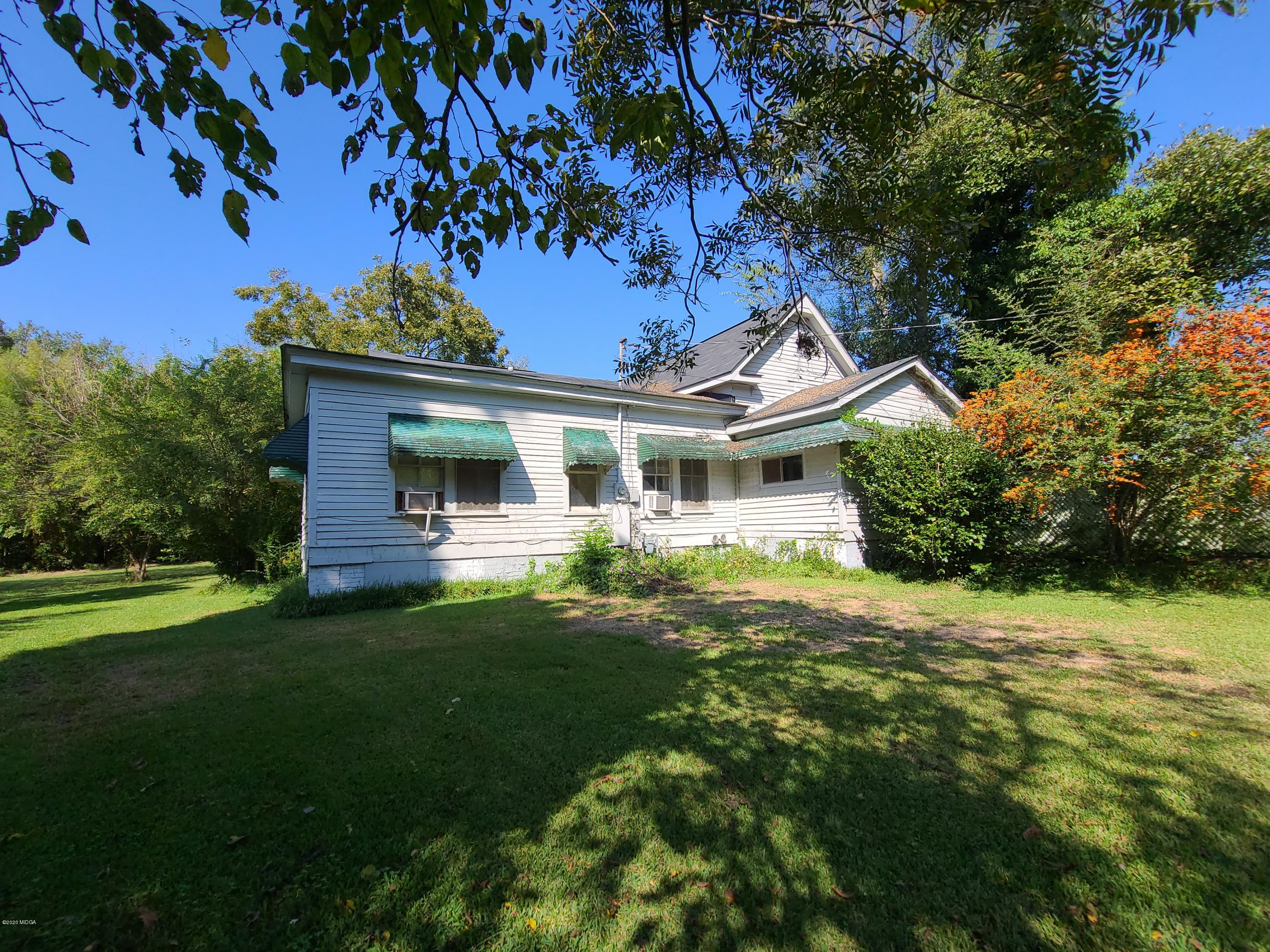 3824 Hartley Bridge Road Macon, GA 31216 - Photo 23 of 26 a front view of a house with garden