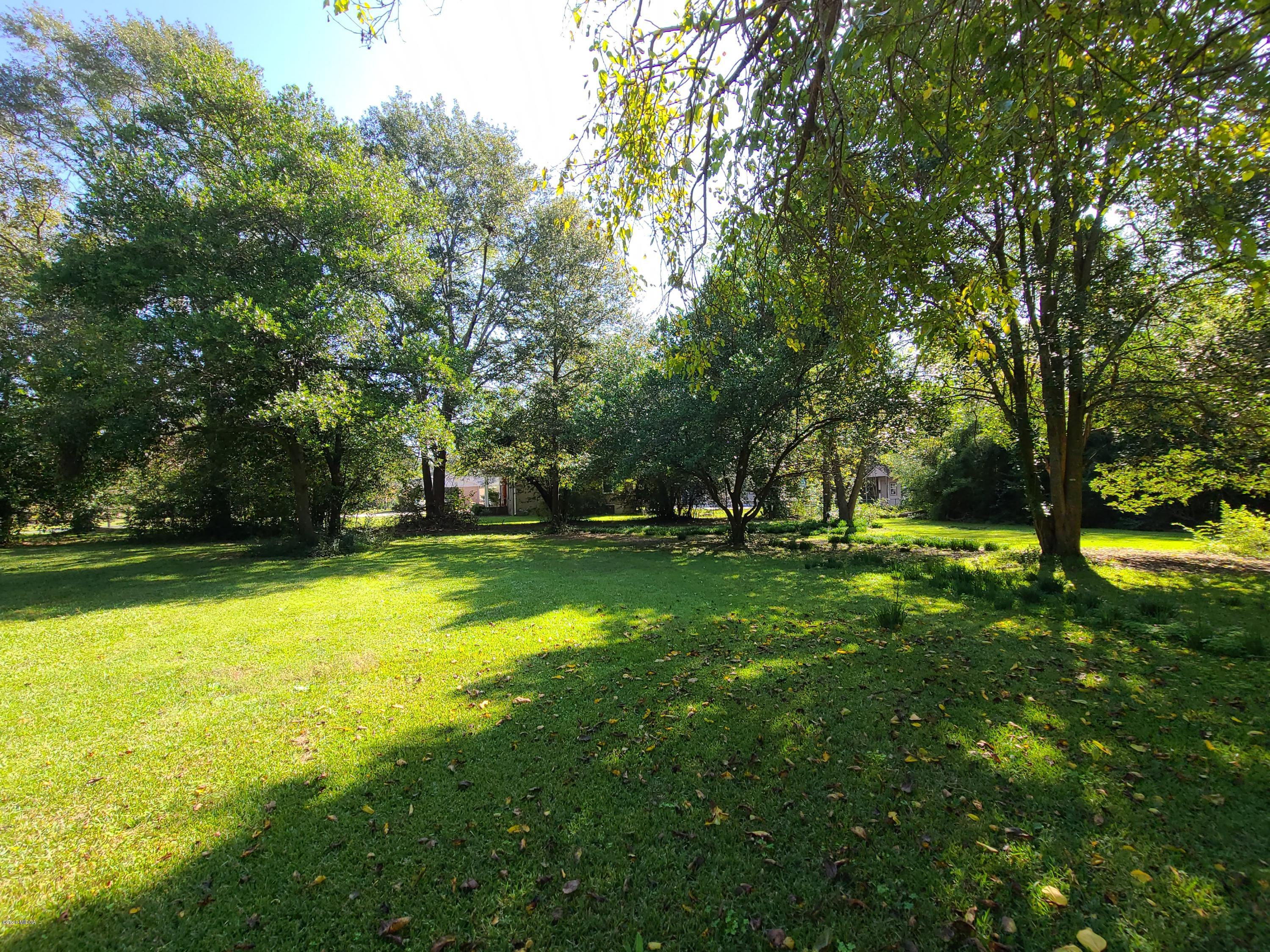 3824 Hartley Bridge Road Macon, GA 31216 - Photo 25 of 26 a view of yard with swimming pool and trees