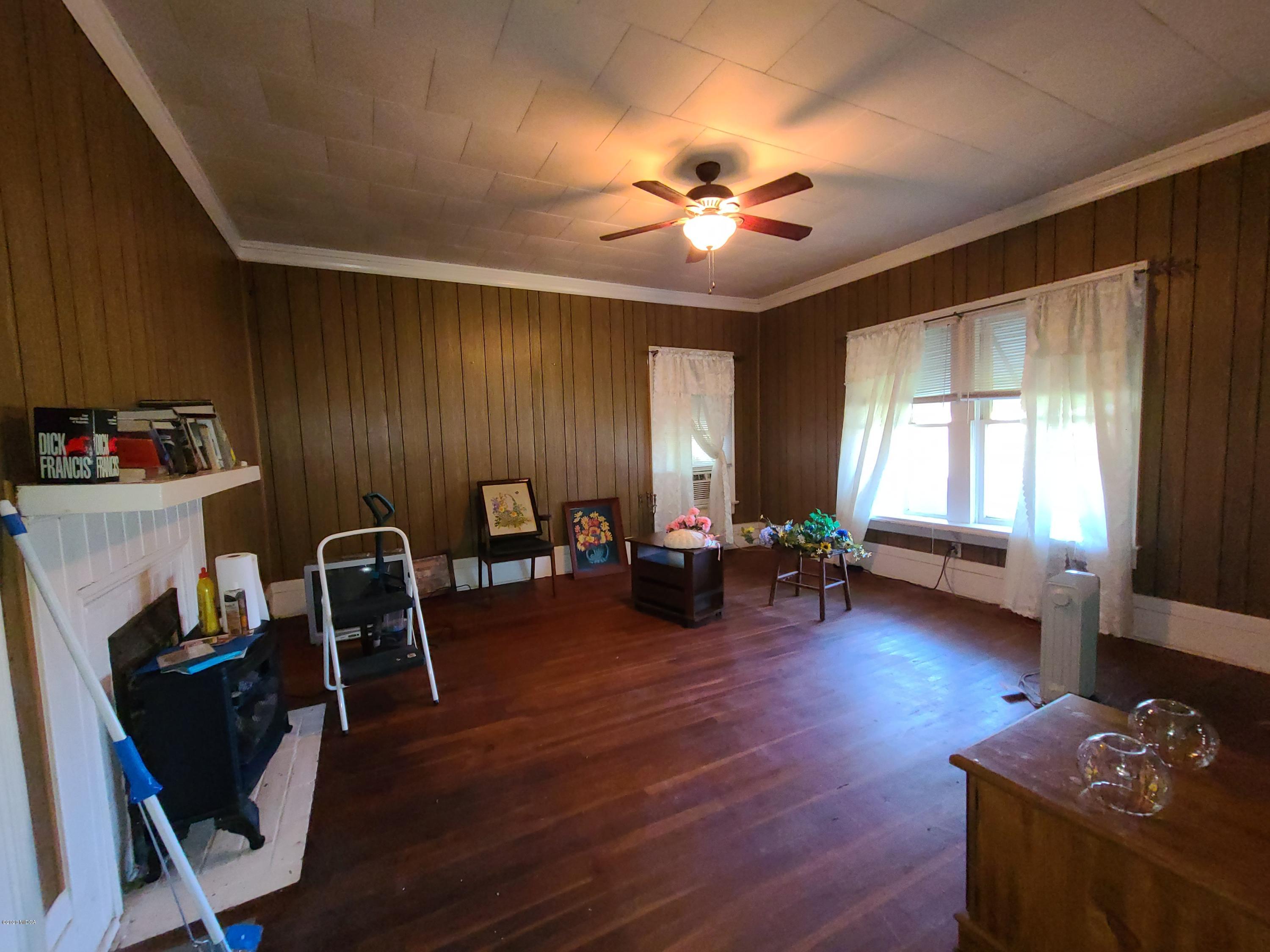 3824 Hartley Bridge Road Macon, GA 31216 - Photo 10 of 26 a living room with furniture and a window