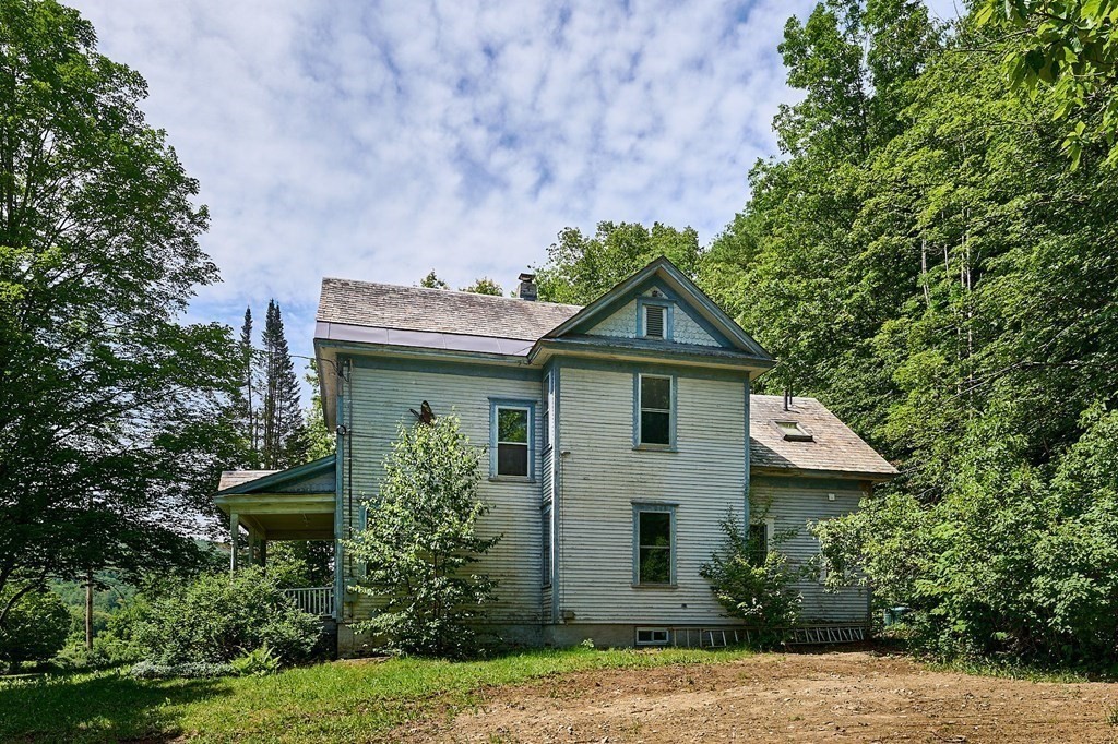 303 Main Road Colrain, MA 01340 - Photo 29 of 30 a front view of a house with garden
