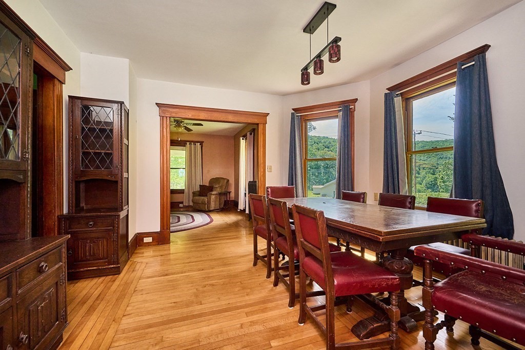 303 Main Road Colrain, MA 01340 - Photo 3 of 30 a dining room with furniture window wooden floor