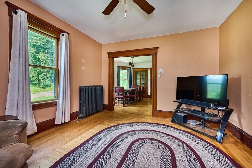 303 Main Road Colrain, MA 01340 - Photo 7 of 30 a view of a livingroom with furniture and a flat screen tv