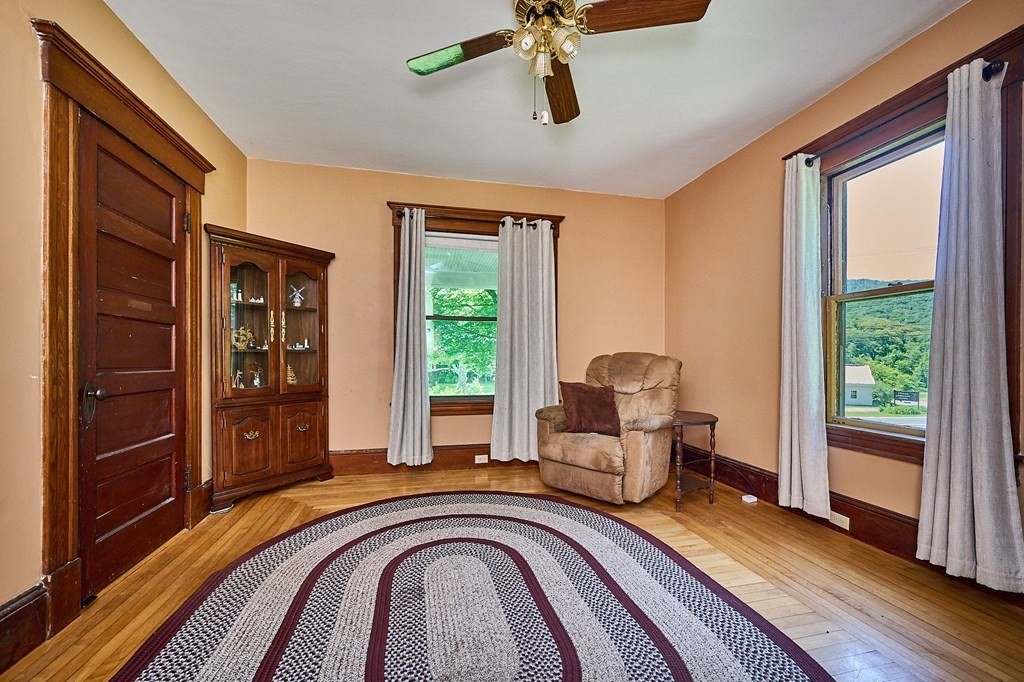 303 Main Road Colrain, MA 01340 - Photo 8 of 30 a bedroom with a bed and wooden floor