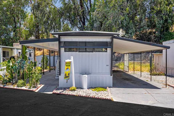 swimming pool view with a seating space