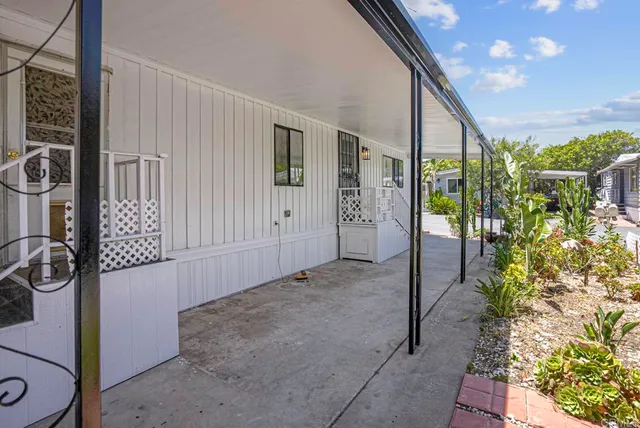 a view of a porch with seating space