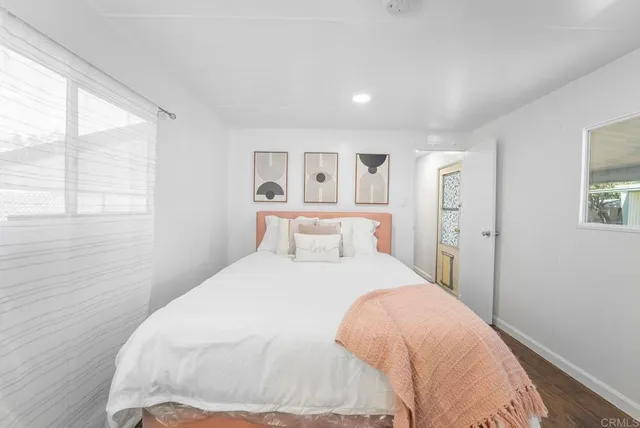 a large white bed in a white room