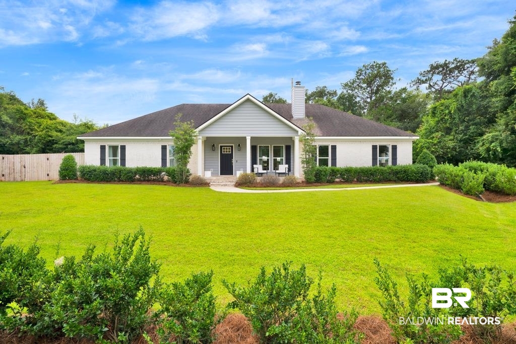379 Pecan Ridge Boulevard Fairhope, AL 36532 - Photo 1 of 21 White brick exterior with a contrasting gray siding gable