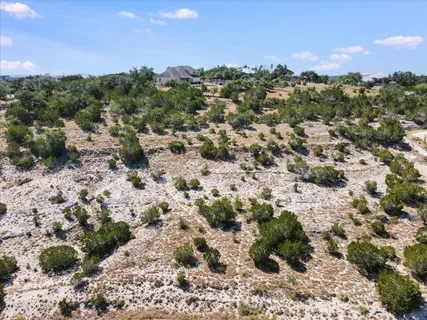 a view of a covered with trees in the background