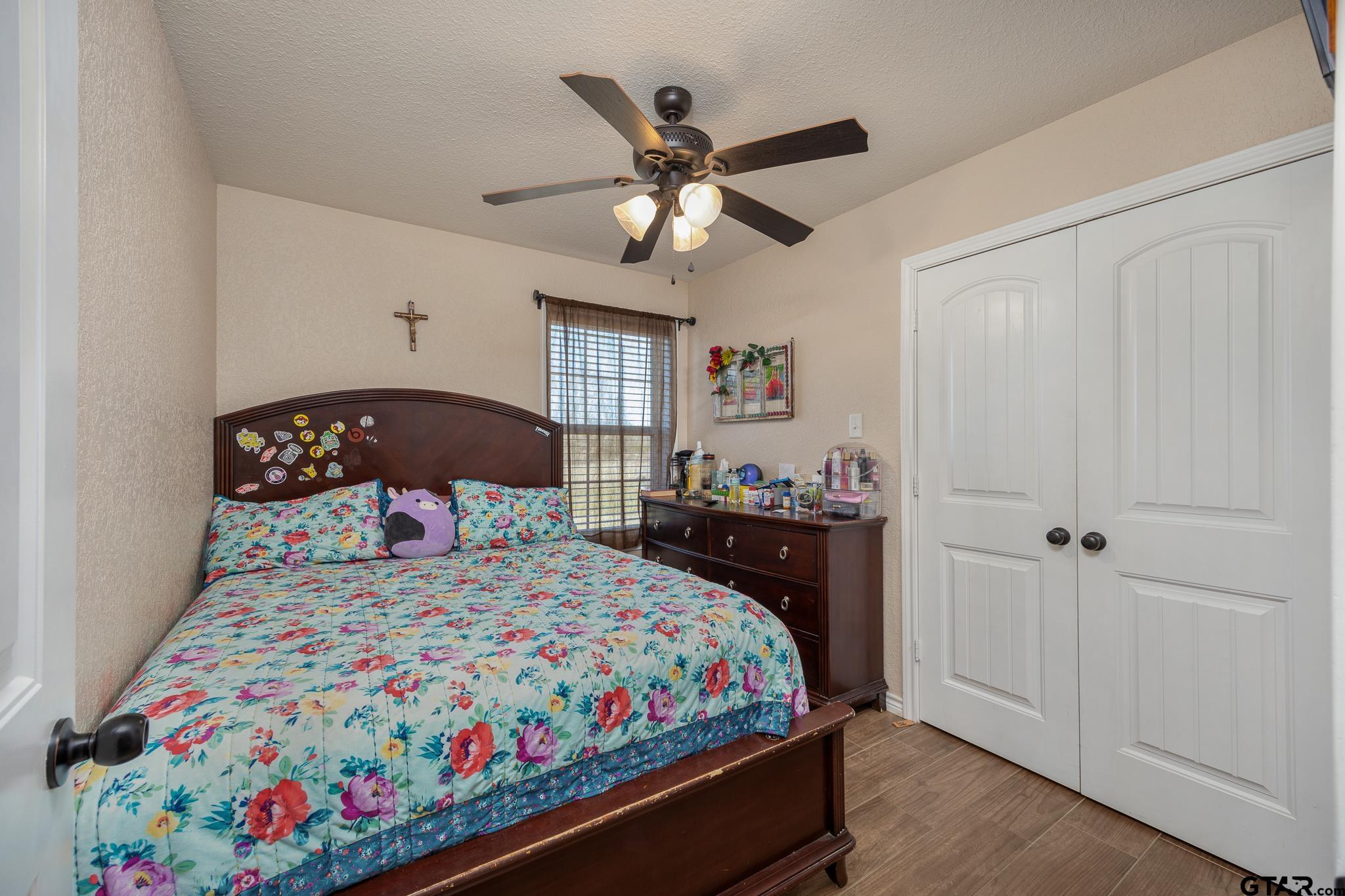 7573 County Road 48 Tyler, TX 75704 - Photo 19 of 31 a bedroom with a bed and a window
