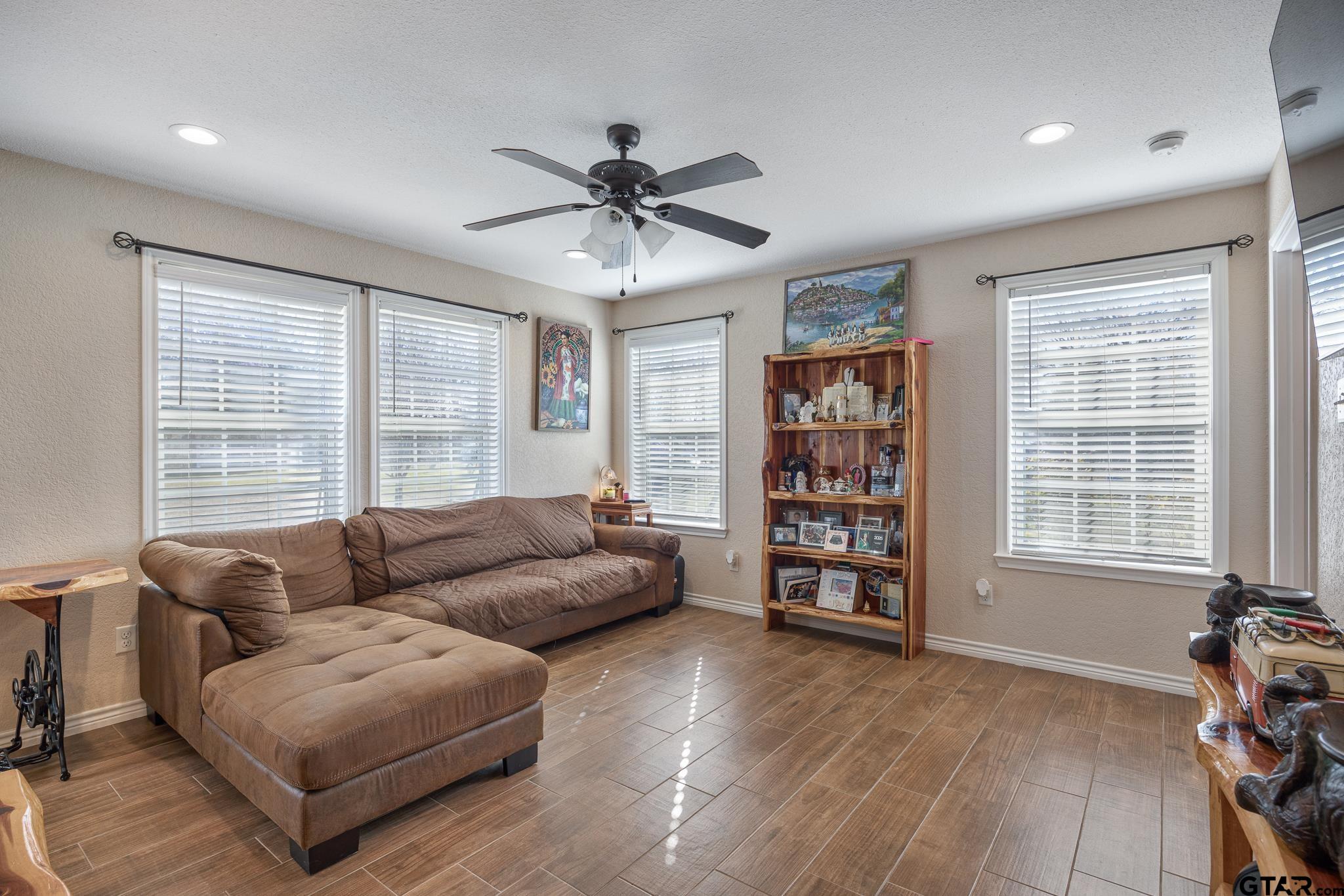 7573 County Road 48 Tyler, TX 75704 - Photo 10 of 31 a living room with furniture and a large window