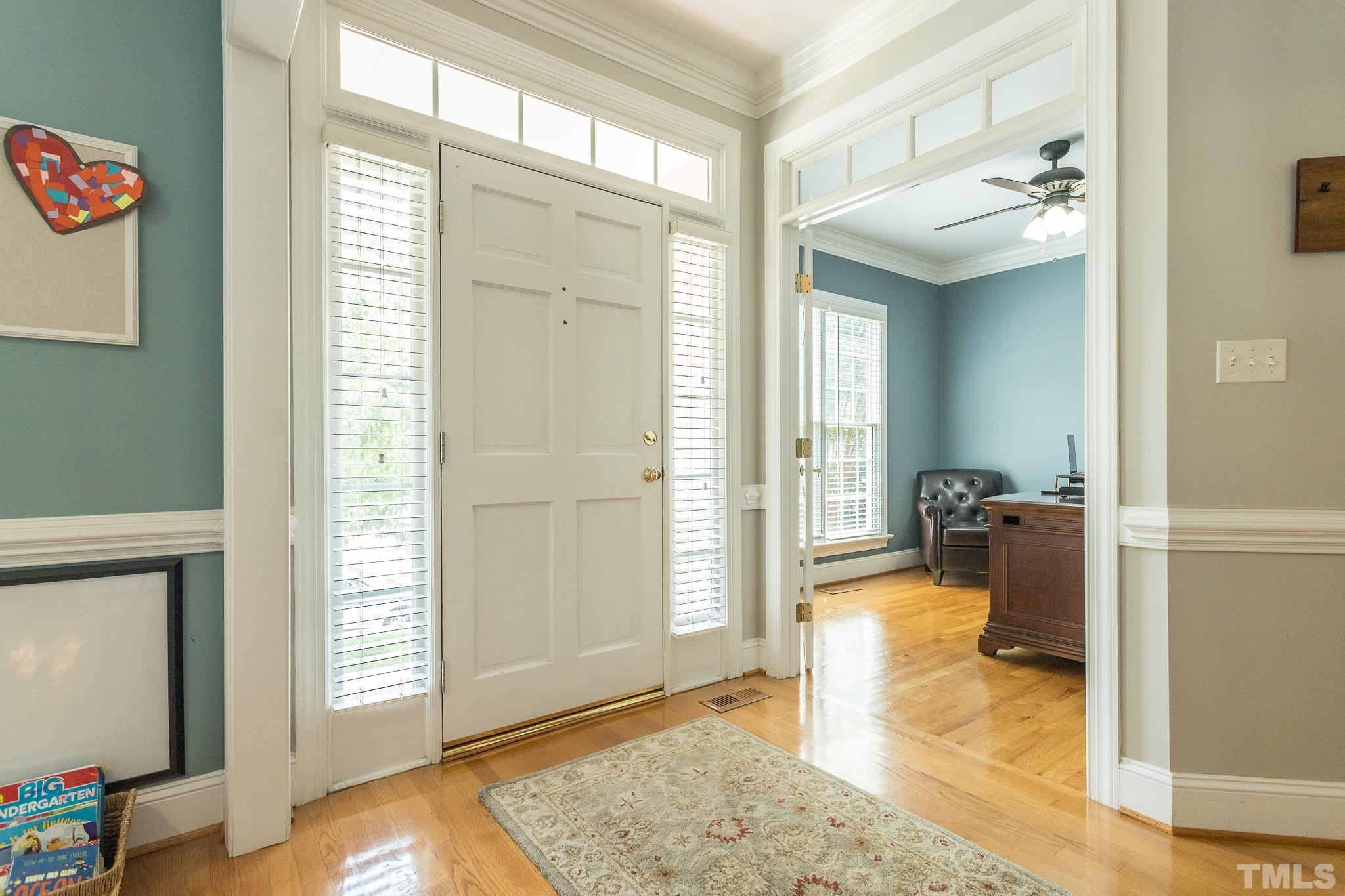 4508 Sandbridge Court Raleigh, NC 27612 - Photo 3 of 36 a view of a livingroom with wooden floor and a window