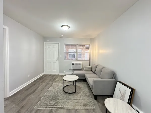 a living room with furniture and window