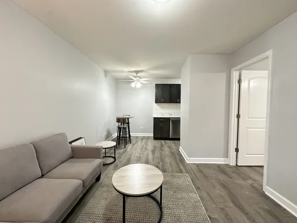a living room with furniture a fireplace and a television