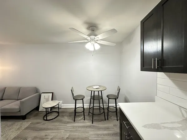 a workspace with furniture and white walls