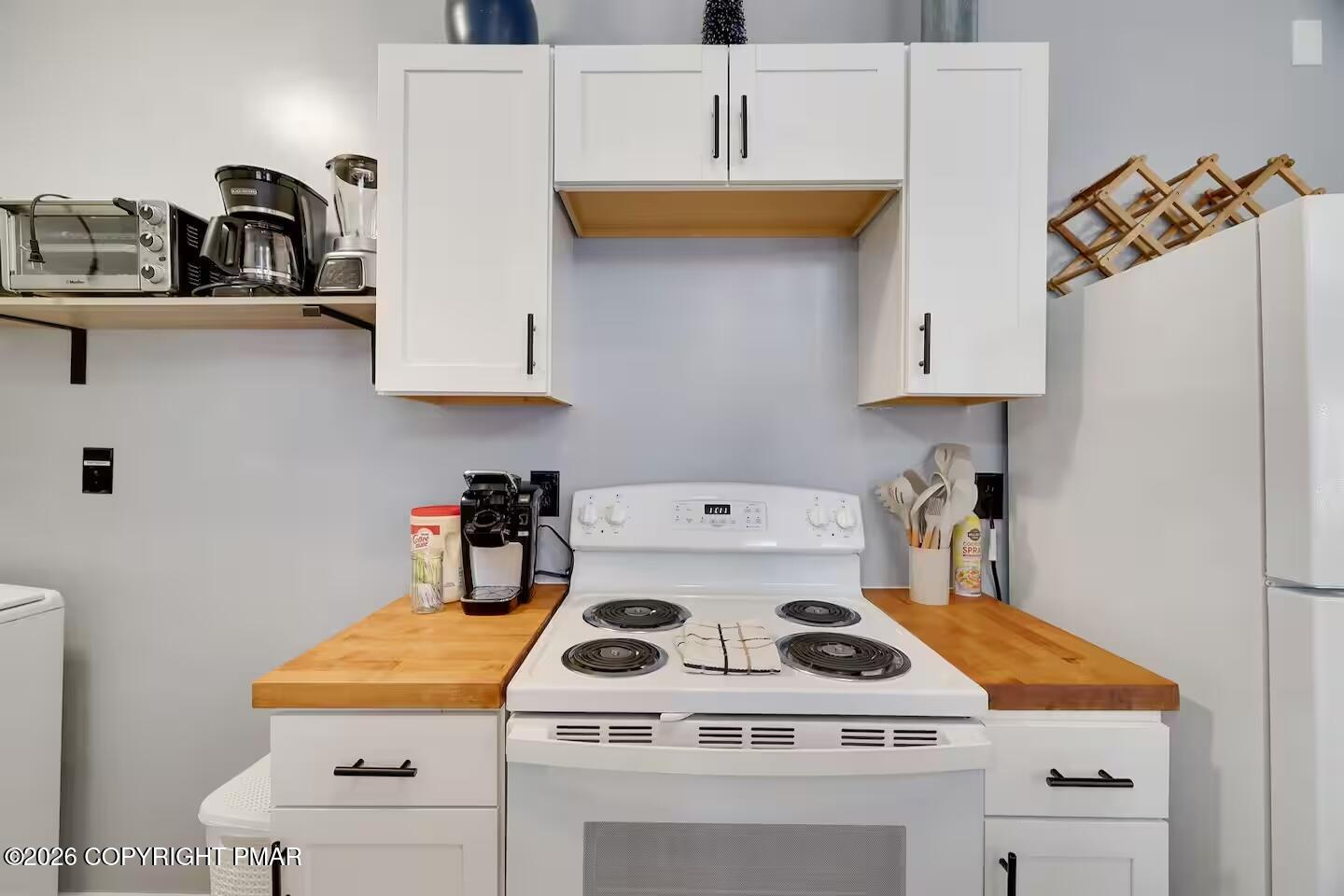 242 St Andrews Drive Bushkill, PA 18324 - Photo 15 of 36 a white stove top oven sitting inside of a kitchen