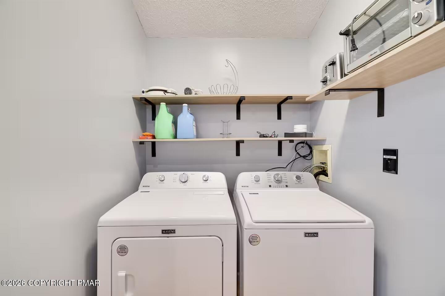 242 St Andrews Drive Bushkill, PA 18324 - Photo 18 of 36 a utility room with dryer and washer