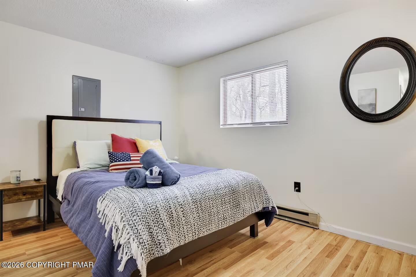 242 St Andrews Drive Bushkill, PA 18324 - Photo 25 of 36 a bedroom with a bed and a painting on the wall
