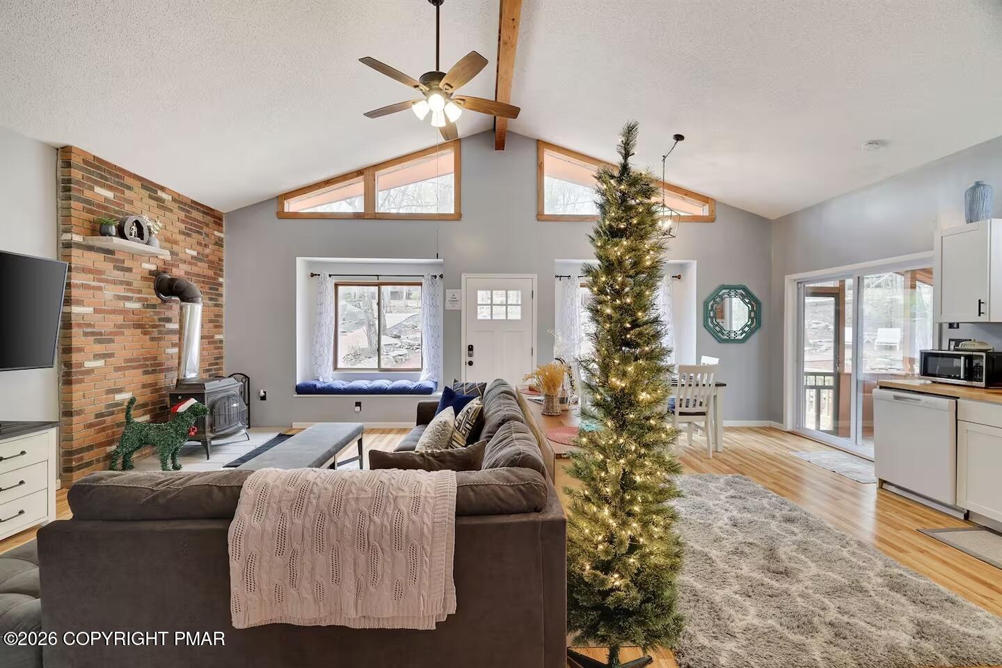 242 St Andrews Drive Bushkill, PA 18324 - Photo 6 of 36 a living room with furniture plant and a window