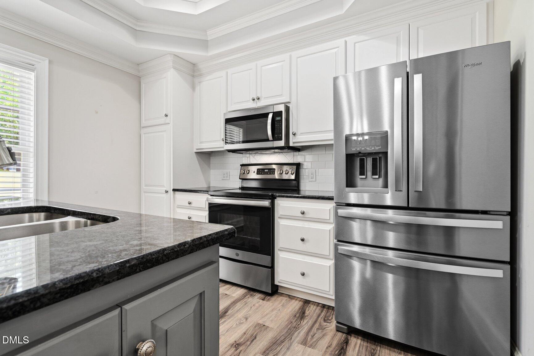 726 Thomas Road Rocky Mount, NC 27801 - Photo 13 of 55 a kitchen with granite countertop a refrigerator stove and sink