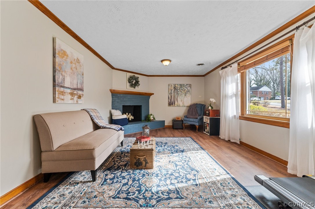 8600 Burgundy Road Richmond, VA 23235 - Photo 23 of 32 HUGE flexible space on ground floor with new LVP, perfect for a playroom, office, or secondary family room.