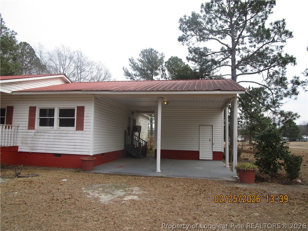 256 Chesters Road Roseboro, NC 28382 - Photo 4 of 22 a view of a house with a yard and potted plants