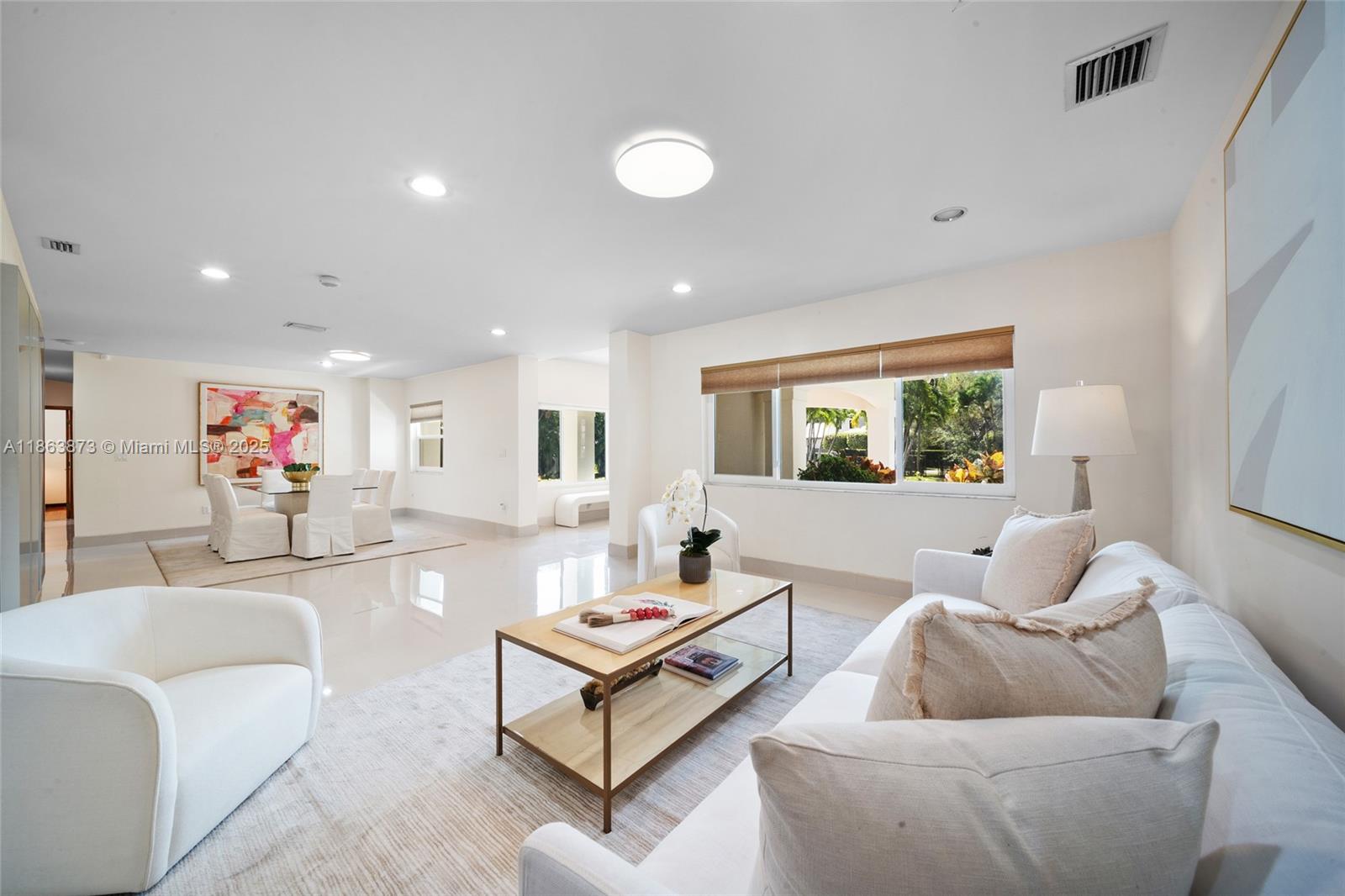 6125 Southwest 109th Street Pinecrest, FL 33156 - Photo 12 of 40 a living room with furniture and a window