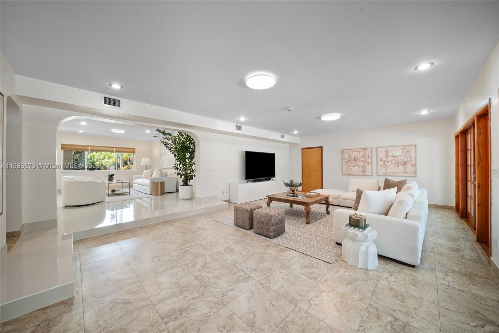 6125 Southwest 109th Street Pinecrest, FL 33156 - Photo 13 of 40 a living room with furniture and a flat screen tv