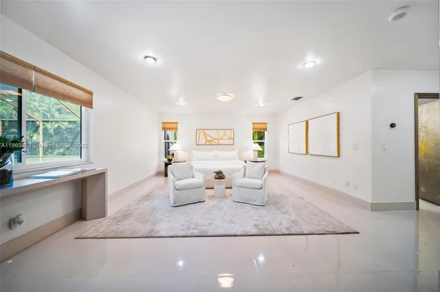 a living room with furniture and window