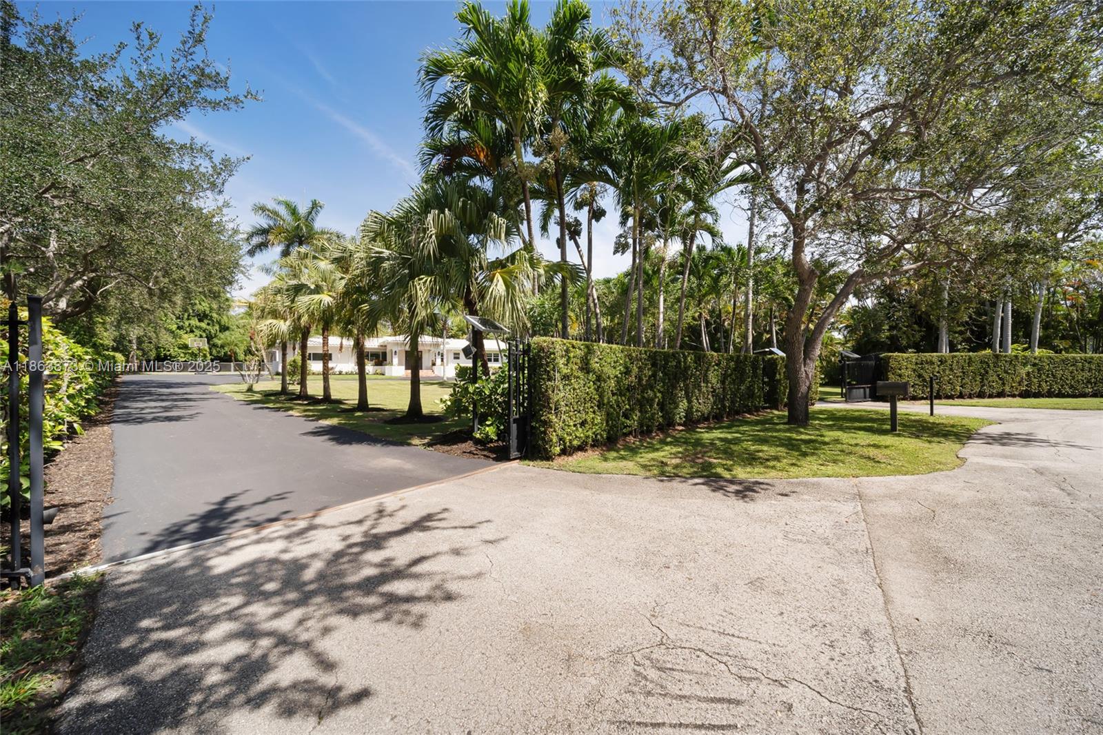 6125 Southwest 109th Street Pinecrest, FL 33156 - Photo 3 of 40 a view of road and trees