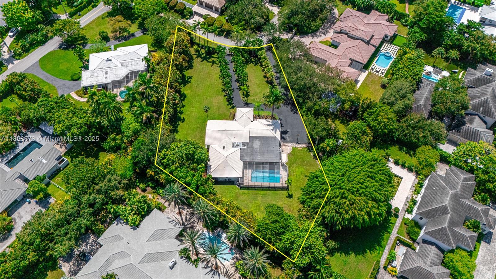 6125 Southwest 109th Street Pinecrest, FL 33156 - Photo 38 of 40 an aerial view of a house with a yard and garden