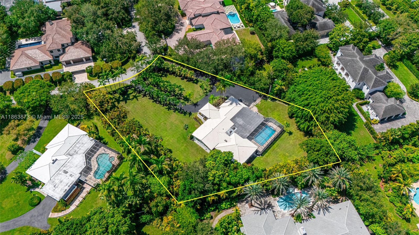 6125 Southwest 109th Street Pinecrest, FL 33156 - Photo 39 of 40 an aerial view of a house with a yard and lake view