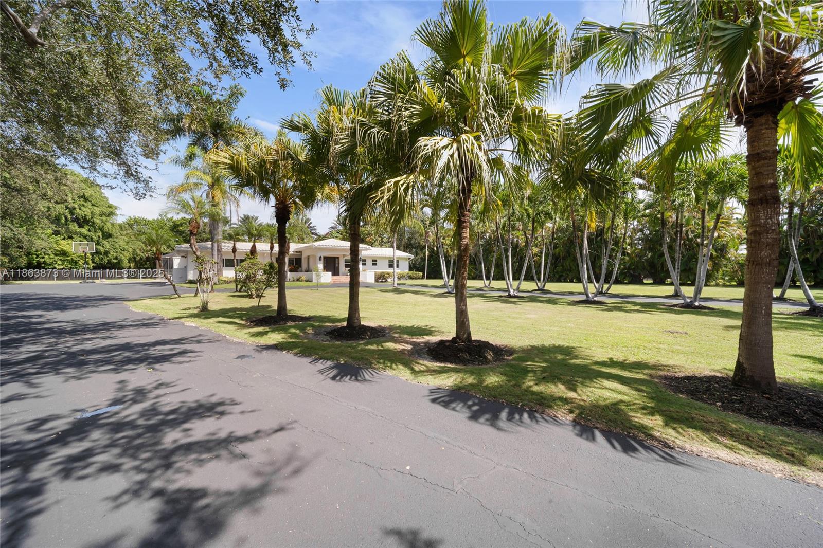 6125 Southwest 109th Street Pinecrest, FL 33156 - Photo 5 of 40 a view of a park with swings and slides