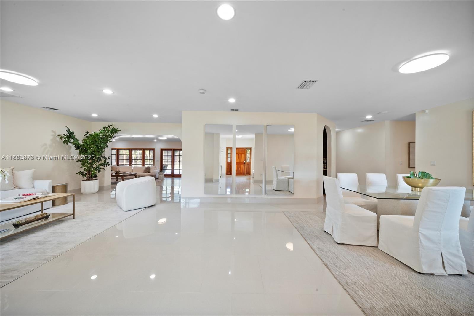 6125 Southwest 109th Street Pinecrest, FL 33156 - Photo 8 of 40 a living room with furniture and a wooden floor