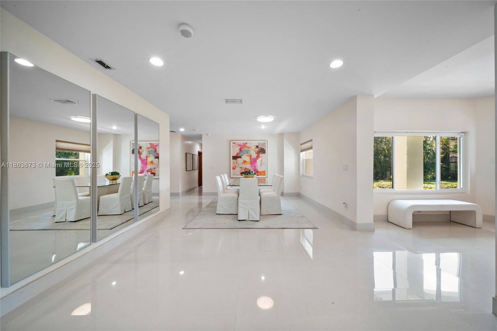 6125 Southwest 109th Street Pinecrest, FL 33156 - Photo 9 of 40 a living room with furniture and a large window