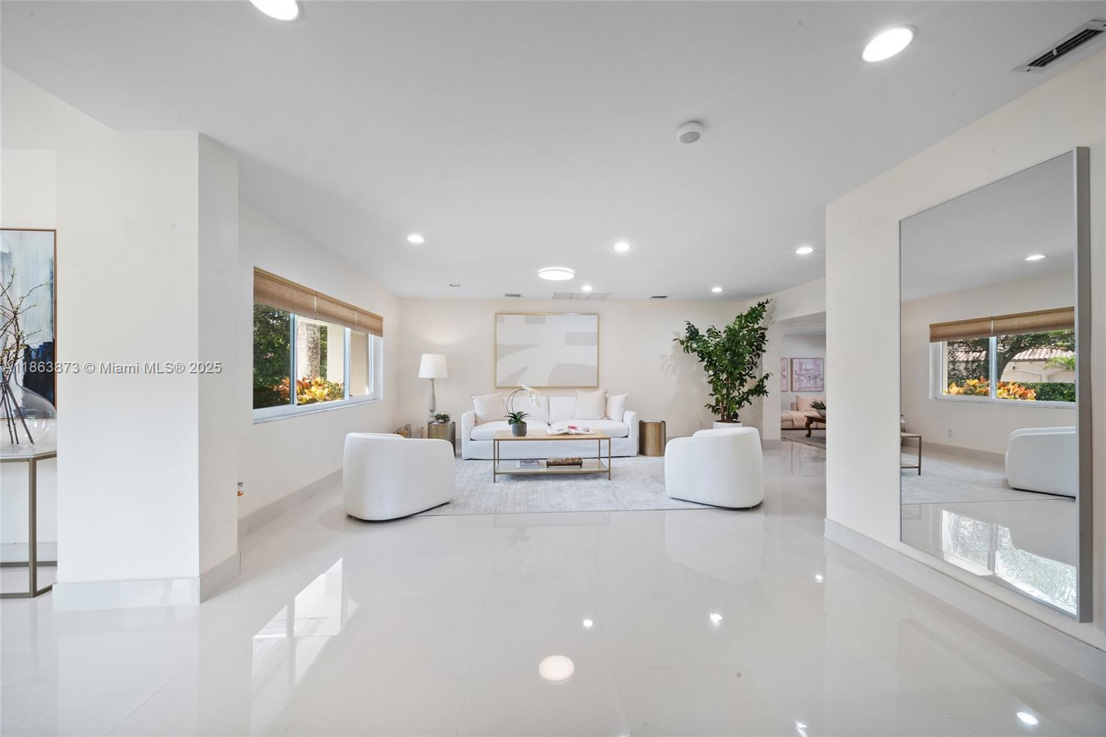 6125 Southwest 109th Street Pinecrest, FL 33156 - Photo 10 of 40 a living room with furniture and a potted plant