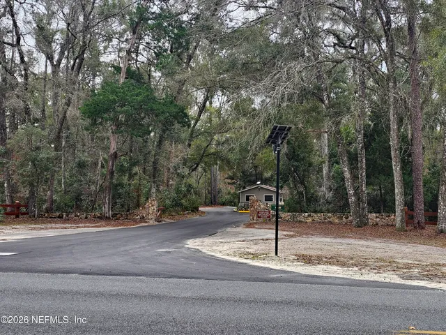 a street sign next to a road