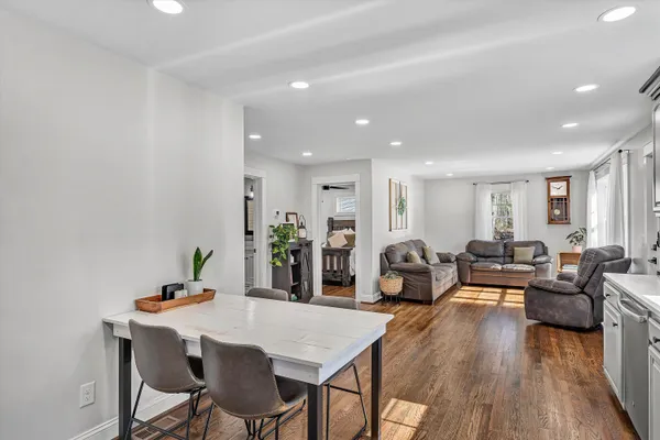 a living room with furniture a wooden floor and furniture