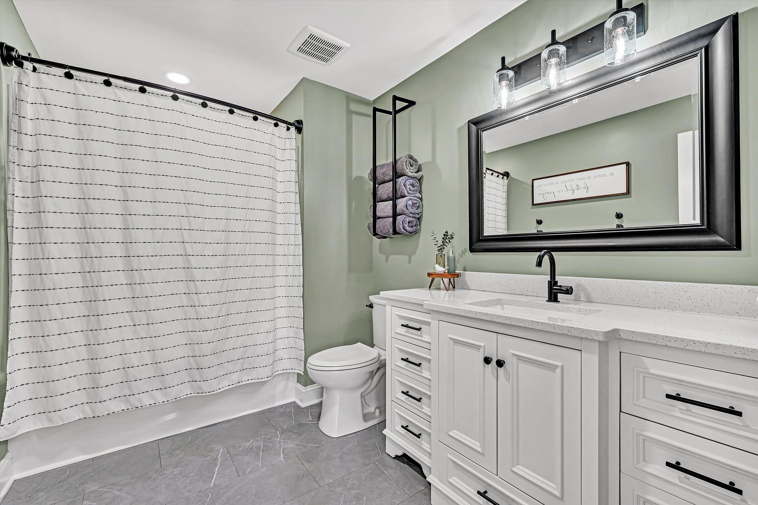 1990 Edwardsville Road Hardy, VA 24101 - Photo 22 of 45 a bathroom with a toilet sink and mirror