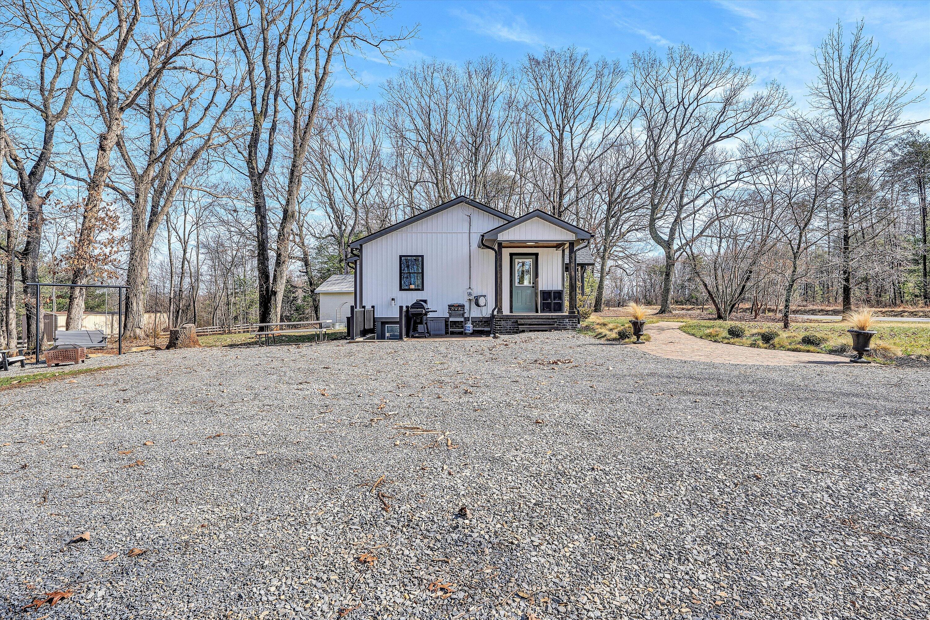 1990 Edwardsville Road Hardy, VA 24101 - Photo 35 of 45 a front view of a house with a yard covered with snow and trees
