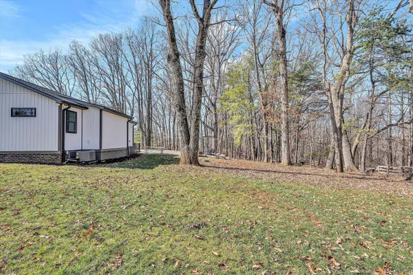 a backyard of a house with lots of green space